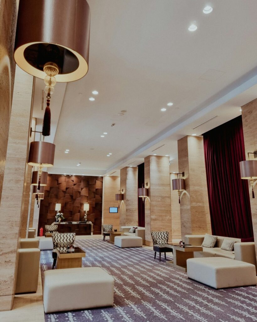 Spacious hotel foyer with seating areas outside a meeting room